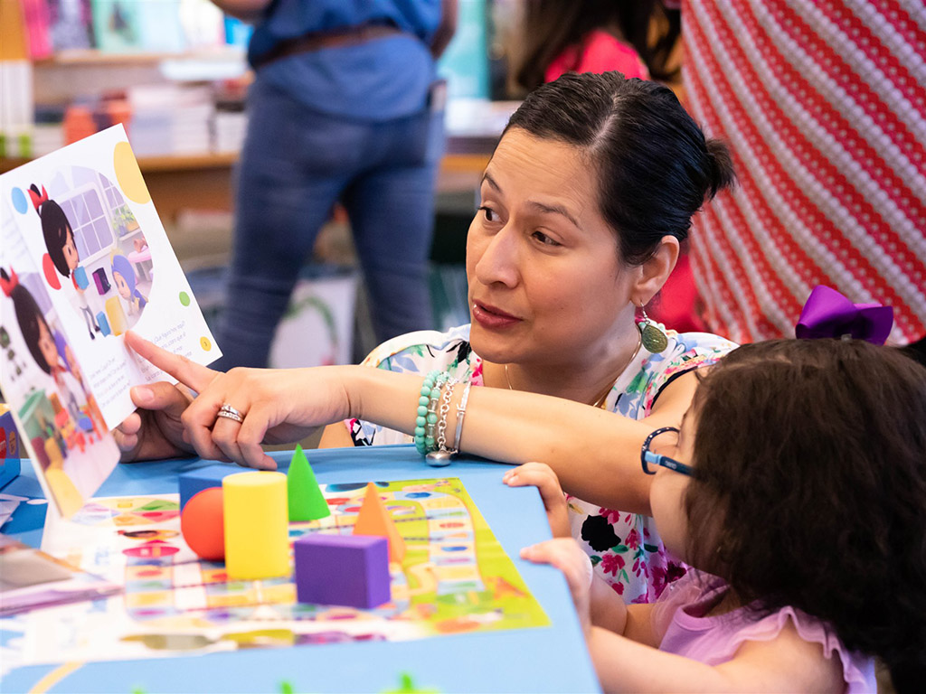 McAllen, Texas. Parents and kids read together.